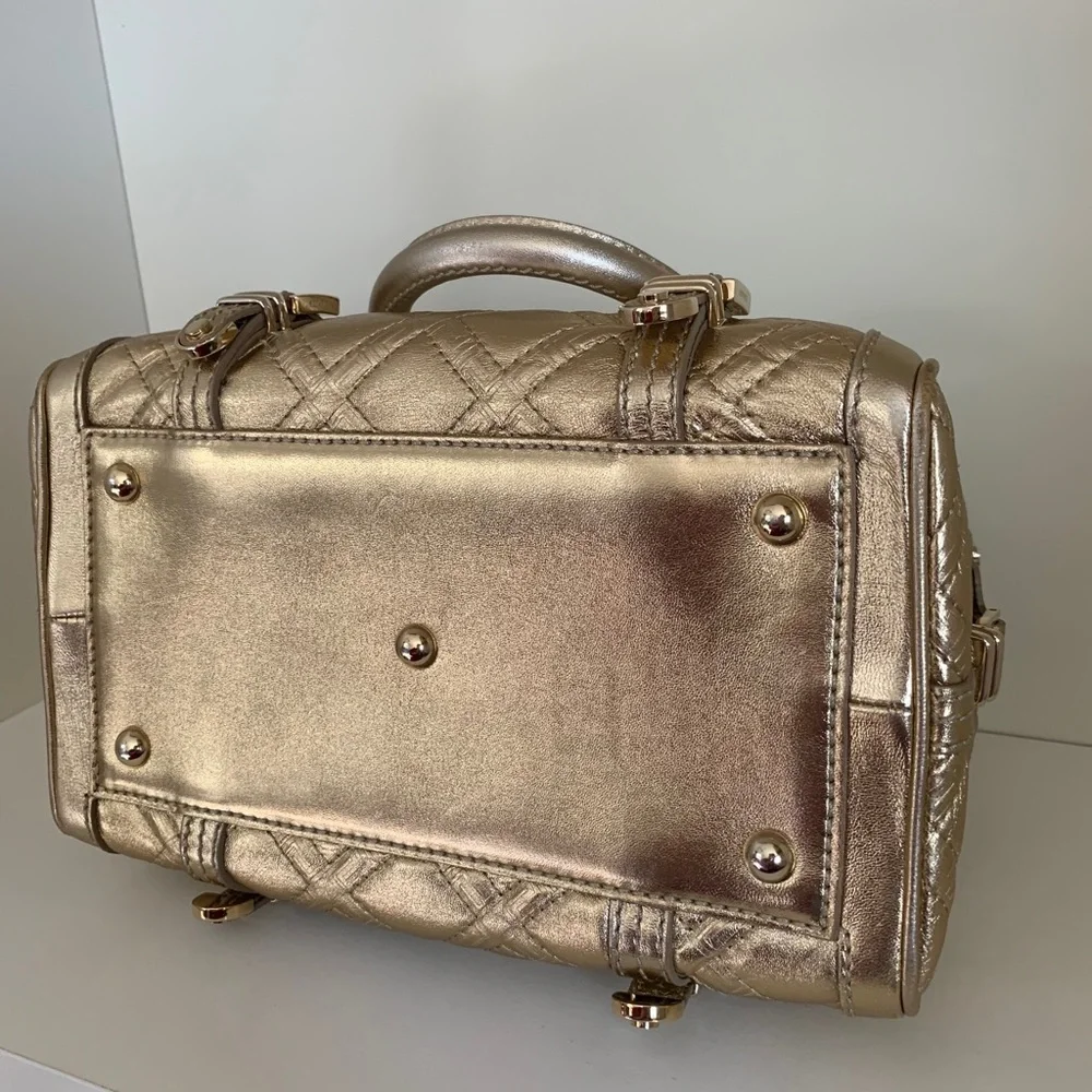 Hold Versace gold quilted handbag